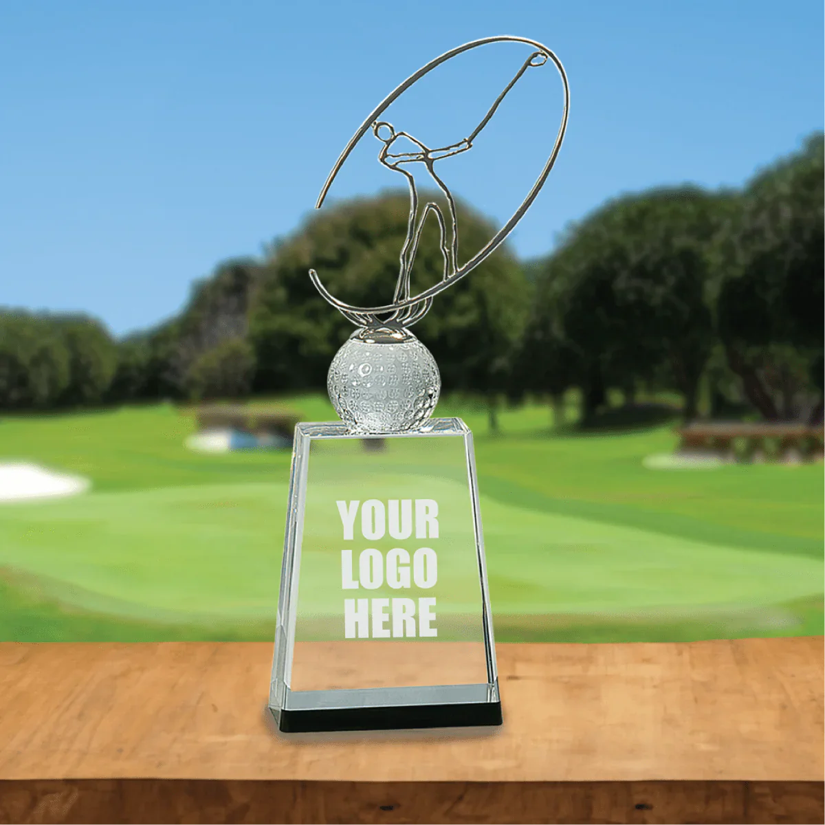 Personalized crystal golf trophy displayed against a golf course